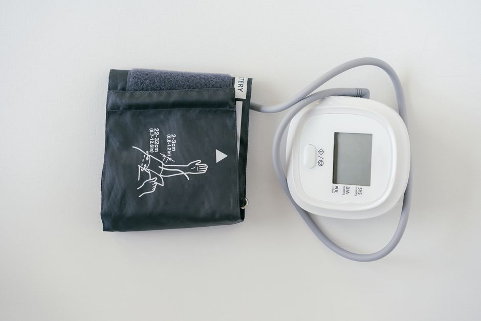 Close-up of a blood pressure monitor cuff and display