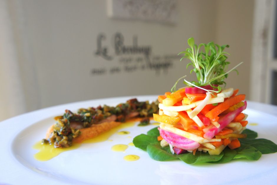 A colorful vegetable salad plated on a white dish