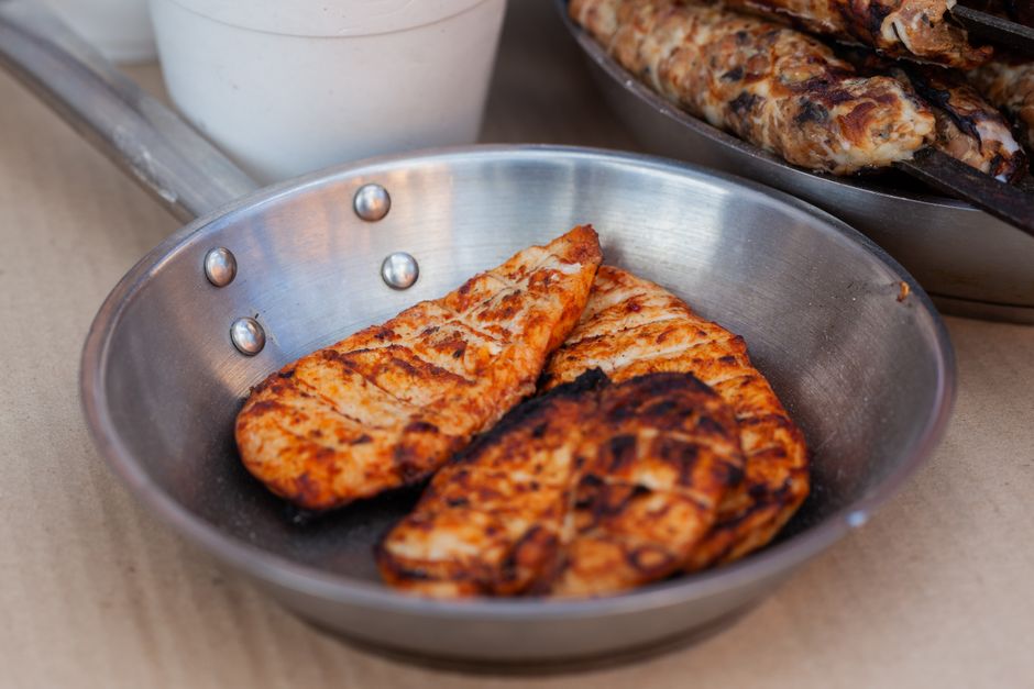 Chicken breast cooking in a pan