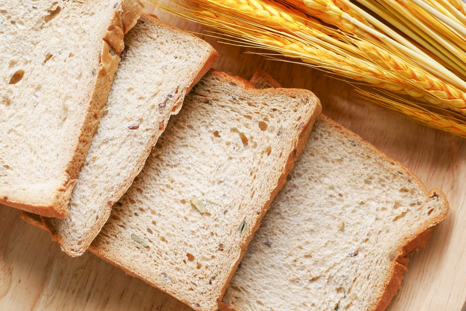 Sliced bread arranged on a wooden surface